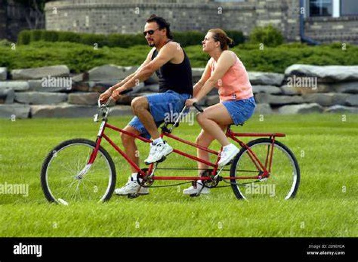 two people on a bike with the words, 17 cute girlfriend quotes and sayings